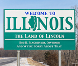 Welcome To Illinois, Land of Lincoln. Rod R. Blagojevich Governor. And we're sorry about that funny roadside sign